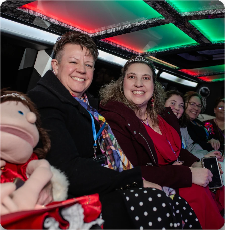 Group of young adults inside of limousine